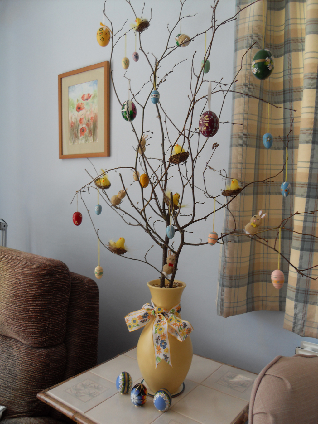 hazel branch decorated with eggs,bunnies and chicks nests