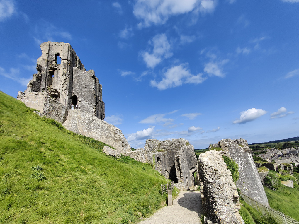 View of Corfe Castle on a blue sky day in May