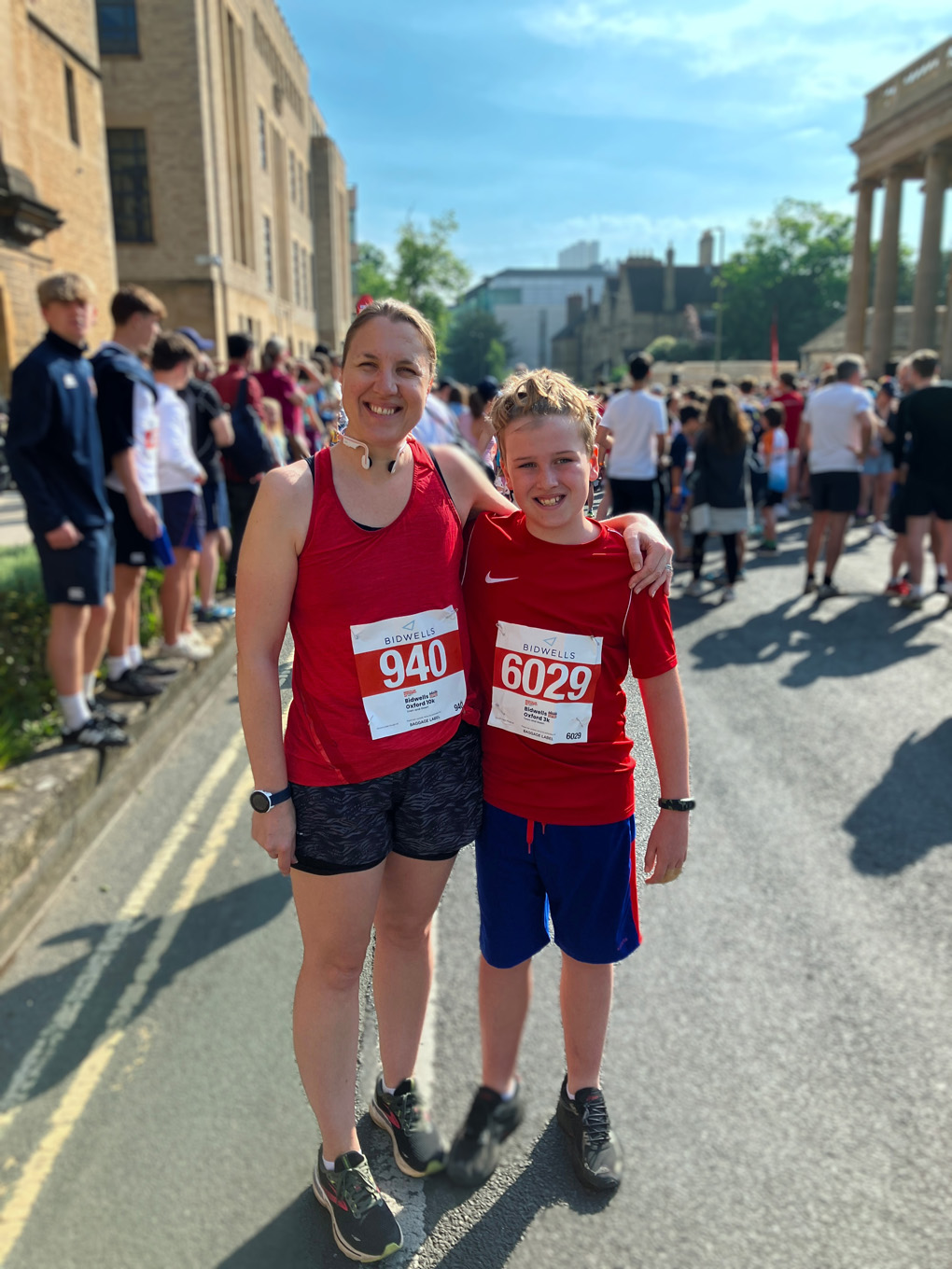 a picture of my wife and son standing at the start of the kids 3K surrounded by hundreds of people!