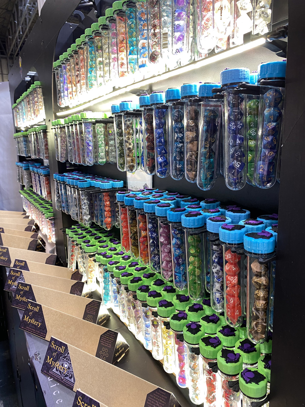 A display of sets of dice in test tubes