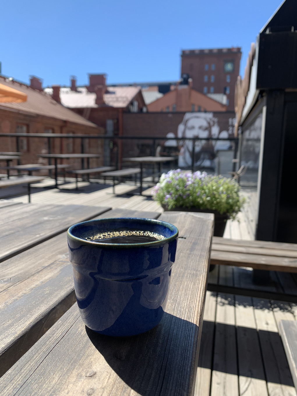 Coffee cup on a table outside.