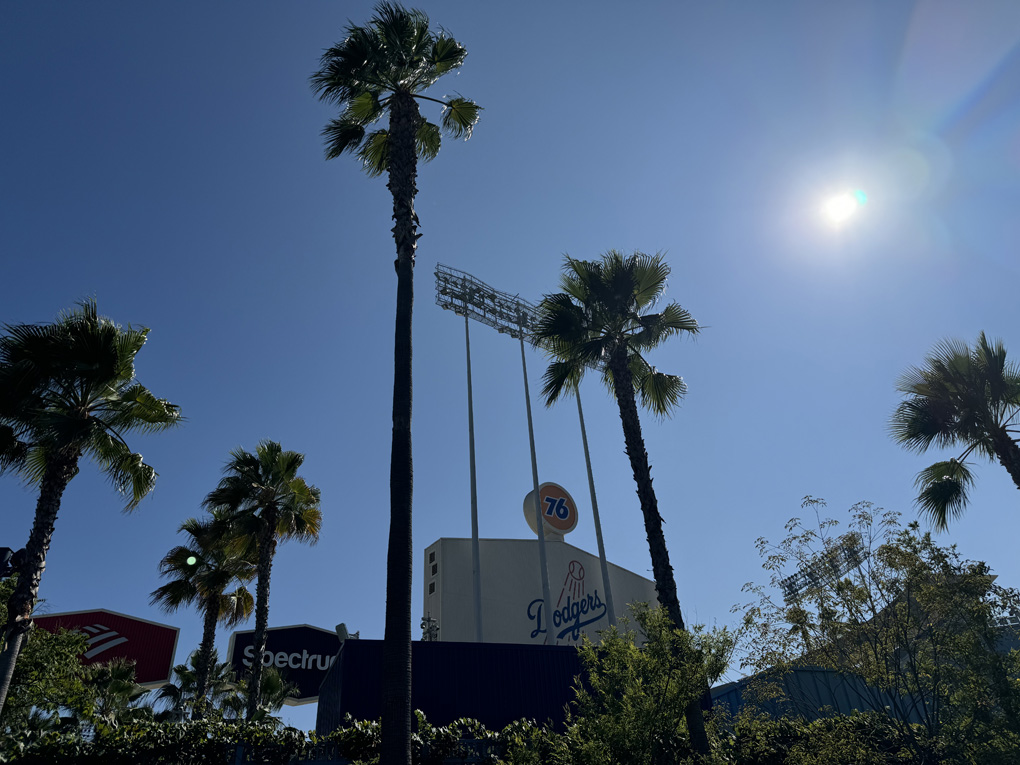 The Dodgers stadium entrance with Palm trees and sunny blue sky