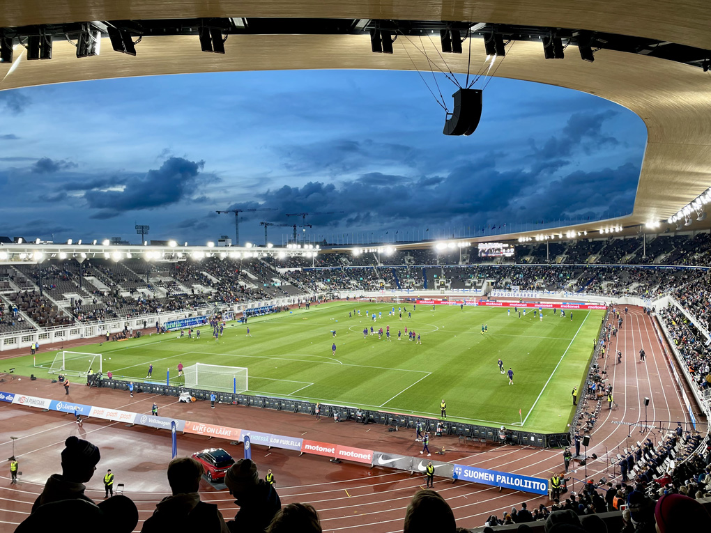 View from the stands to a football pitch in a stadium.