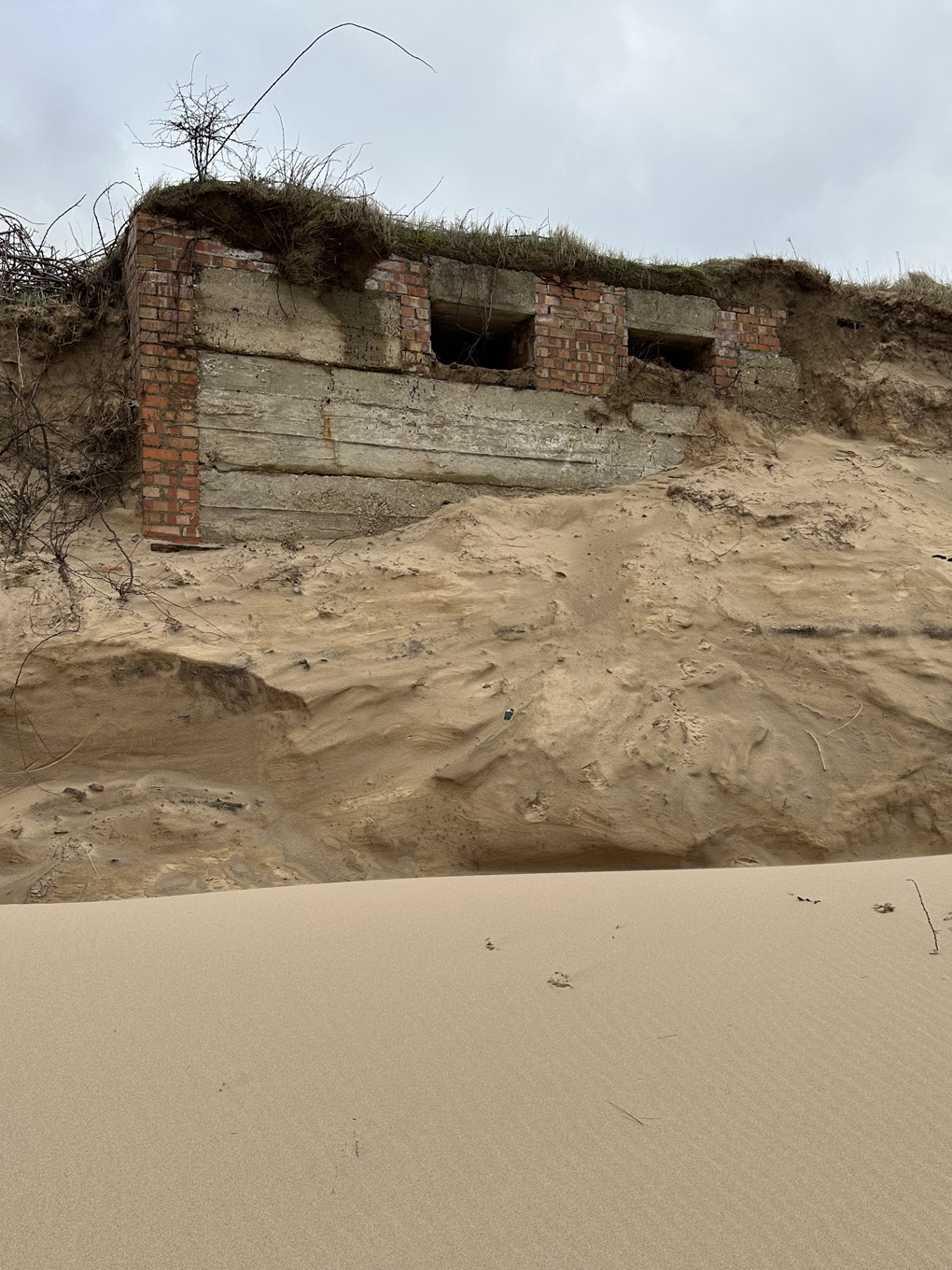 WW2 coastal defenses revealed by high tides on North Norfolk beach