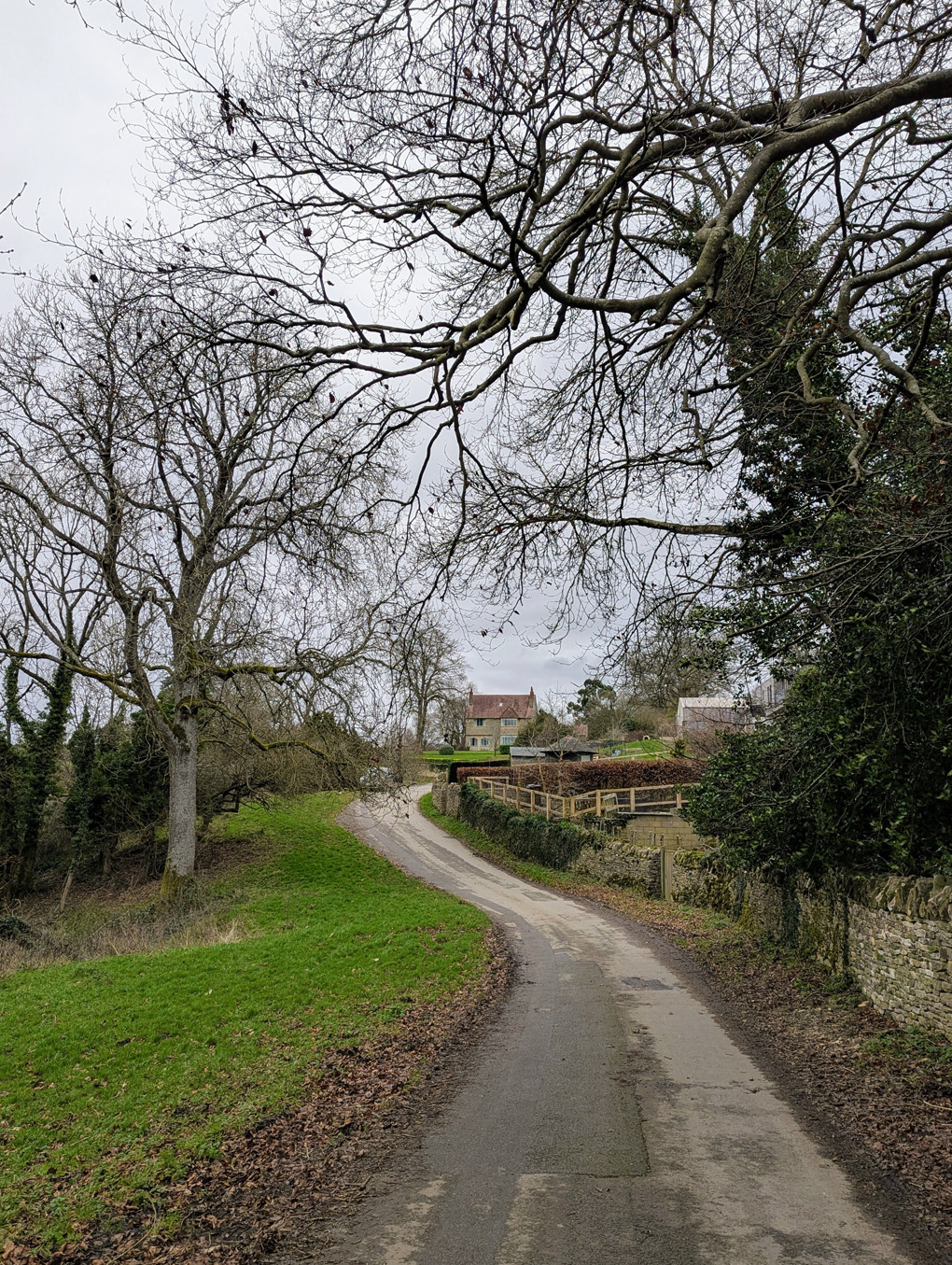 A winding road through Cotswold countryside