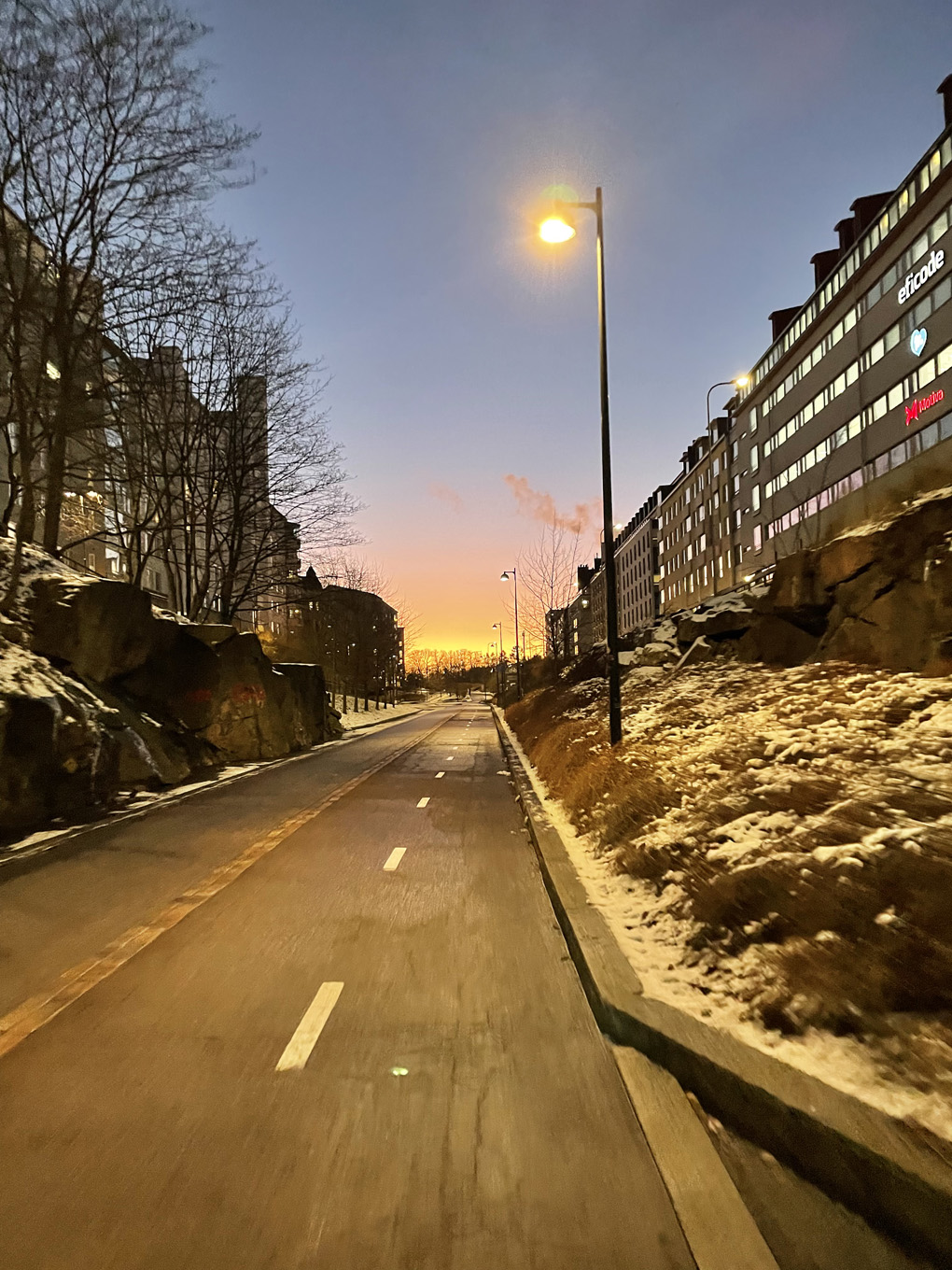 Cycle lane the setting sun in the horizon.