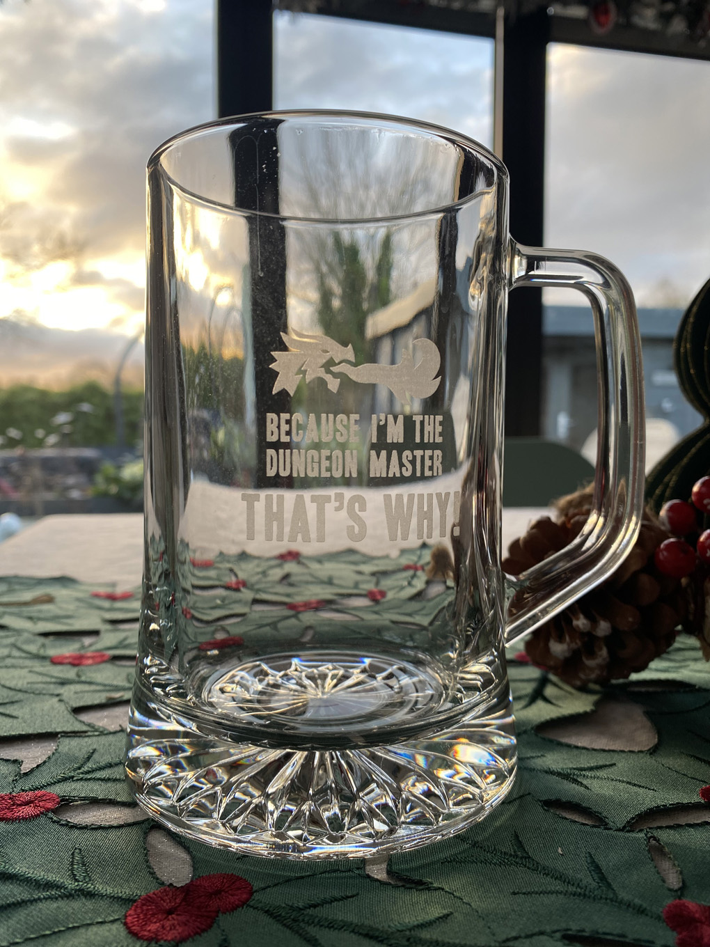 A glass tankard engraved with 