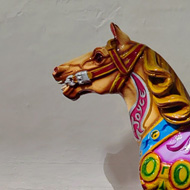 Picture of a wooden fairground horse in a church in Neath.