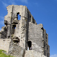 View of Corfe Castle on a blue sky day in May