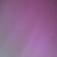 The night sky with purple and blue lights across it - the Northern lights