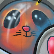 Street art depicting stylised cat astronaut with 