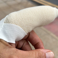 Forefinger bandaged and plastered