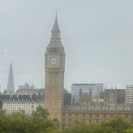 A view over the rooftops of London including the London Eye and Big Ben.