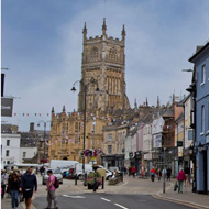 A view of modern day Cirencester showing the buildings that used to be pubs .