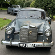 Vintage Mercedes sitting outside a Georgian building