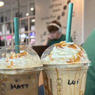 Four Starbucks coffee mugs with names Haidi, Pit, Matt and Lui written on them