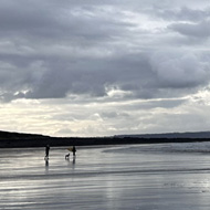 Grey clouds over beach