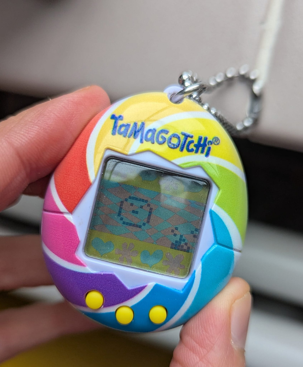 Colourful Tamagotchi doing a poo