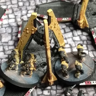 Small plastic miniatures close in to melee combat around their drop craft