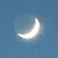 Crescent moon with Venus as hard white dot beneath.